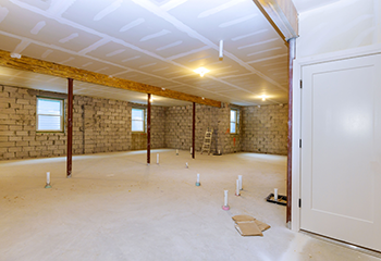 Complete basement transformation with fresh drywall installation and open floor plan design